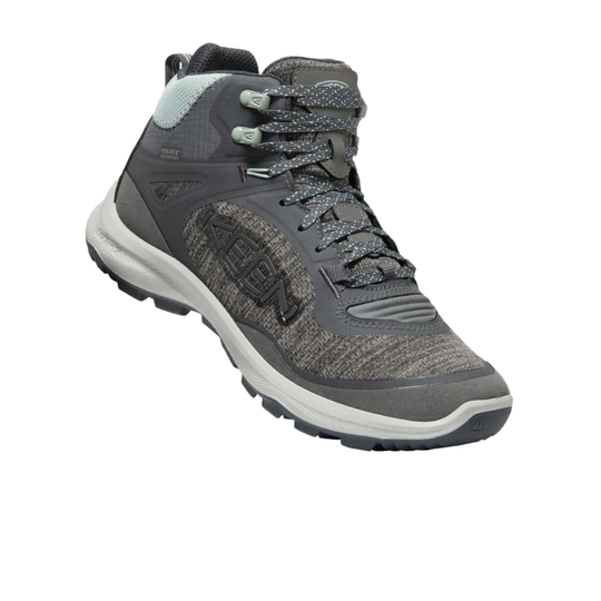 Gray mid-top hiking boot with bungee laces, textured fabric panels, and a white sole
