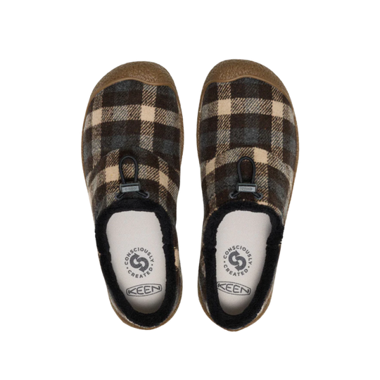 Pair of brown plaid slip-on slippers with black fleece lining and visible KEEN branding