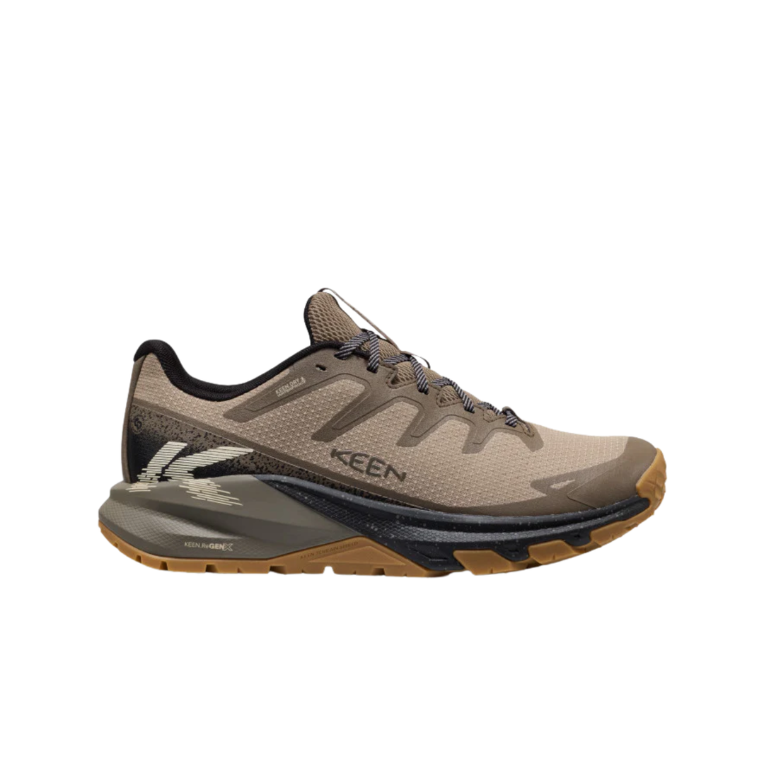 Tan and brown low-top hiking shoe with black trim, bungee laces, and KEEN branding