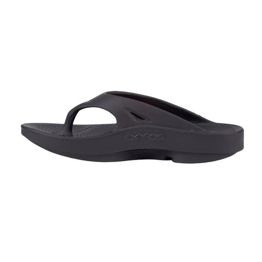 Black thong sandal with a thick cushioned sole and embossed oofos logo