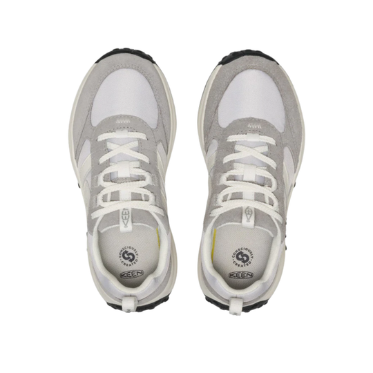 Pair of light gray and white sneakers with white laces, side cutouts, and black rubber toes