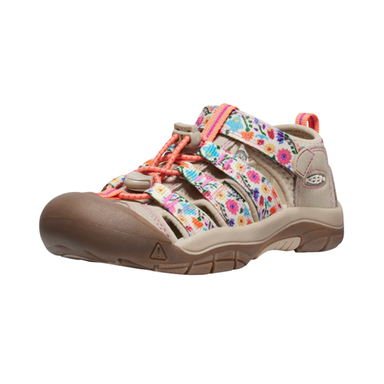 Beige closed-toe kids' hiking sandal with floral straps, orange bungee laces, and a brown toe cap