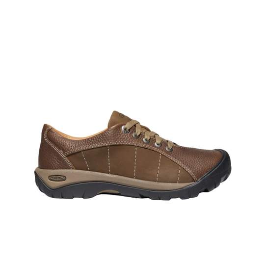  brown leather shoe on a white background