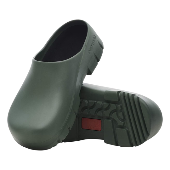 Pair of green rubber clogs on a white background
