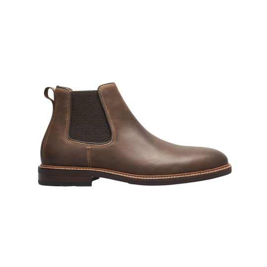 Brown leather Chelsea boot on a white background