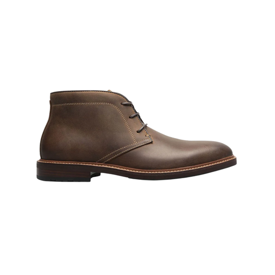 Brown leather chukka boot on a white background