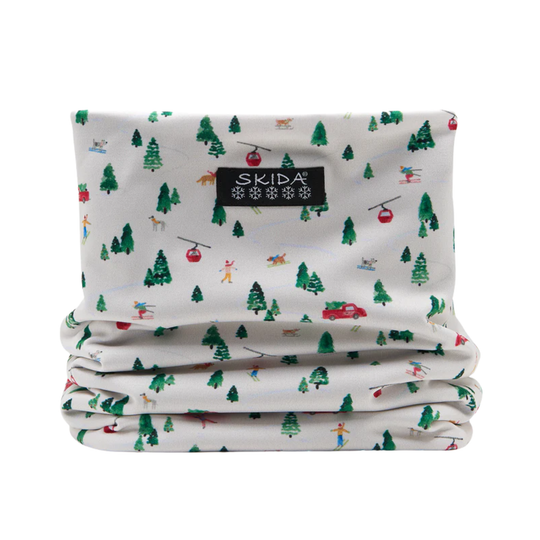 Folded neck gaiter with winter-themed pattern and Skida logo on a white background