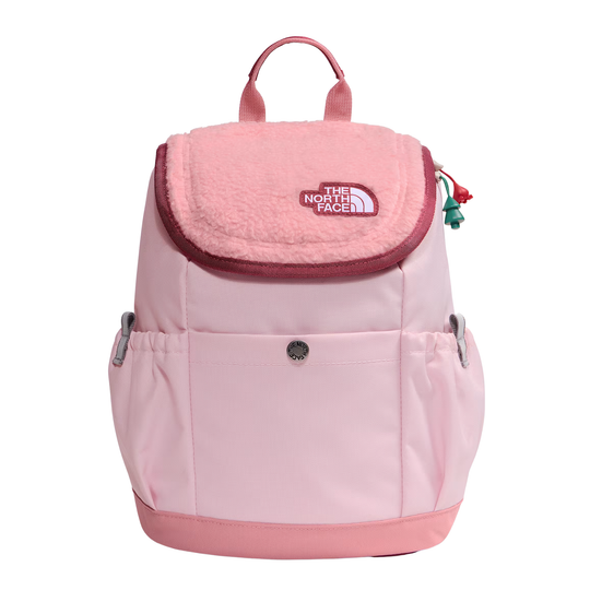 A light pink The North Face backpack with a plush fleece flap, front pocket, and silver side buckles, shown against a plain white background.