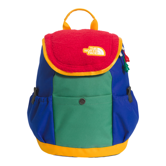 A color-blocked The North Face backpack with a red fleece top flap, green front pocket, blue sides, and yellow trim and handle, shown on a white background.
