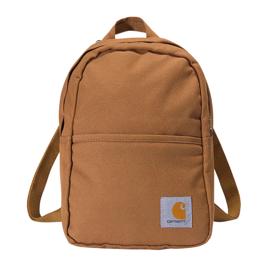 A classic Carhartt backpack in a warm tan canvas color, featuring a front zippered pocket and the signature Carhartt logo patch on the lower right front, set against a plain white background.