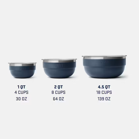Set of three blue measuring cups with volume indicators on a white background