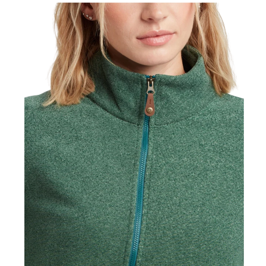 Close-up of a woman wearing a heathered green quarter-zip fleece jacket with a teal zipper and a brown leather pull tab.