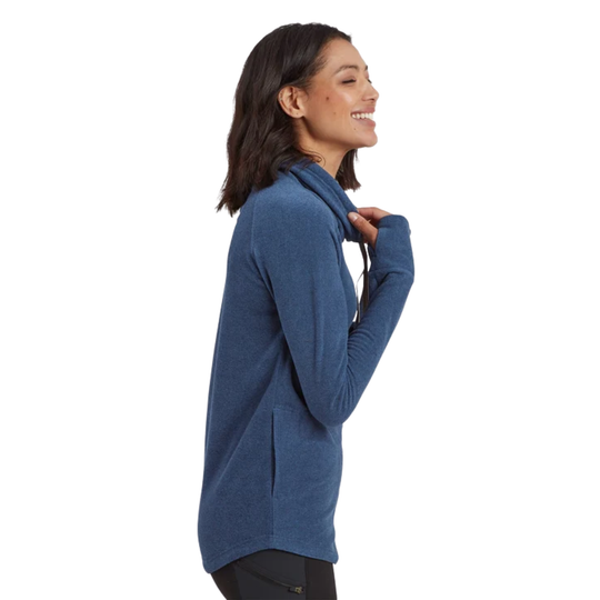 A woman shown in side profile wearing a heathered blue long-sleeve pullover top with a high folded collar, set against a plain white background.