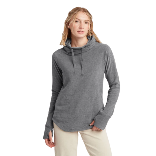 A woman viewed from the front wearing a heather gray long-sleeve top and light beige pants against a plain white background.