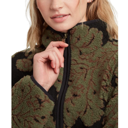 Close-up of a person wearing a textured fleece zip jacket with an olive green and black leaf-like pattern, shown against a plain white background.