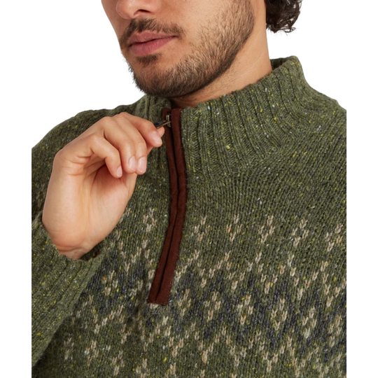 Close-up of a textured knit sweater sleeve in olive green with flecks of yellow, white, and brown, featuring a quarter length zipper. On a white background. 