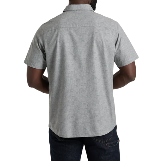 Man wearing a gray short-sleeve button-up shirt on a white background