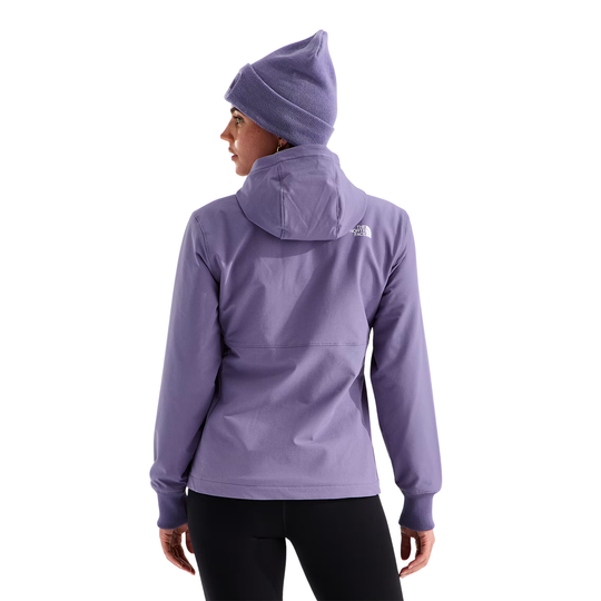 Person wearing a purple jacket and matching beanie on a white background