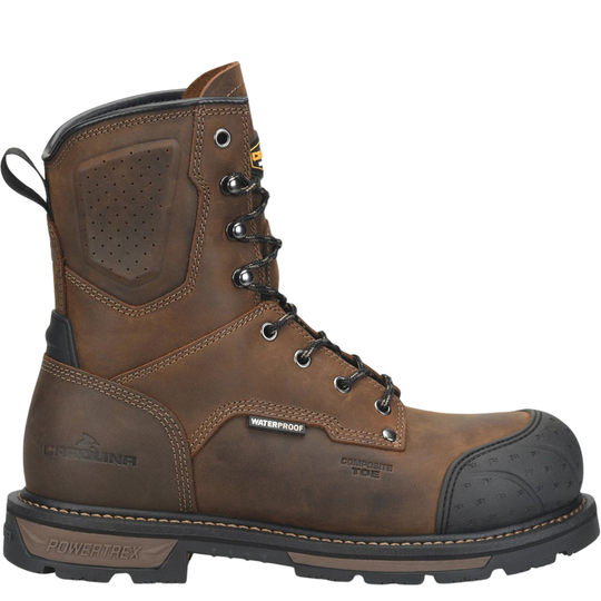 A brown leather Caterpillar work boot with black protective toe cap, laces, and sole, shown from a side profile on a white background.