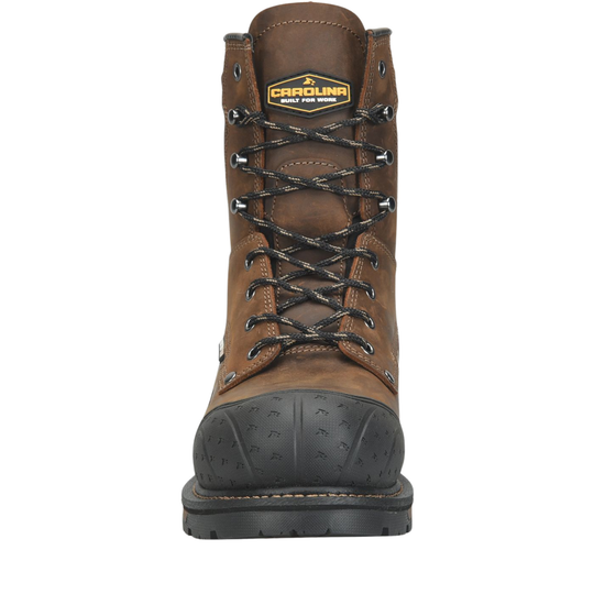 A brown leather work boot with a black rubber toe cap and black laces, shown from a front-facing perspective on a white background. The tongue features a yellow and black Carolina East Fork Mining logo.