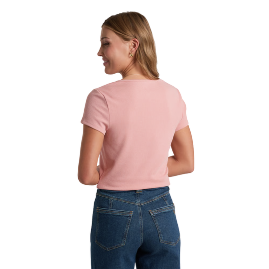 Kuhl Women's Remi Notch Tee - Coral Rose on female model on a white background