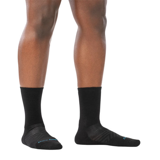 Darn Tough Vermont Women's Micro Crew Cushioned Ultra Lightweight Running Sock - Black on a white background