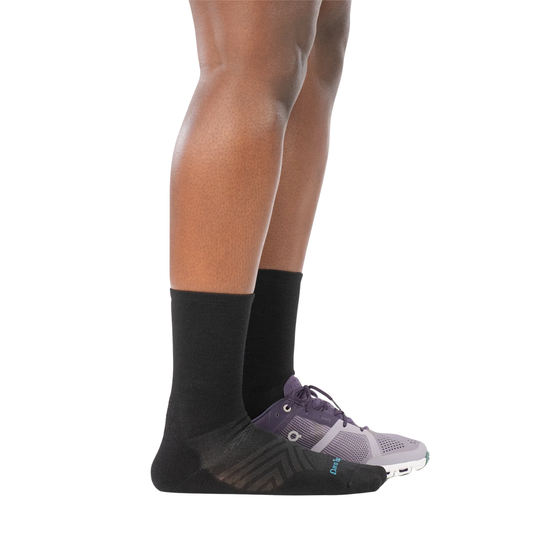 Darn Tough Vermont Women's Micro Crew Cushioned Ultra Lightweight Running Sock - Black on a white background