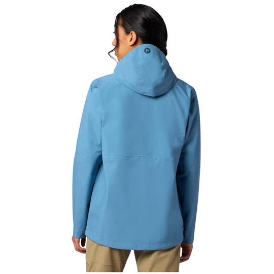 A woman shown from the back wearing a light blue hooded jacket and tan pants against a plain white background.