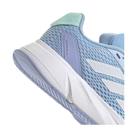 Light blue mesh athletic shoe with white side stripes and a white midsole, shown in close-up side view.