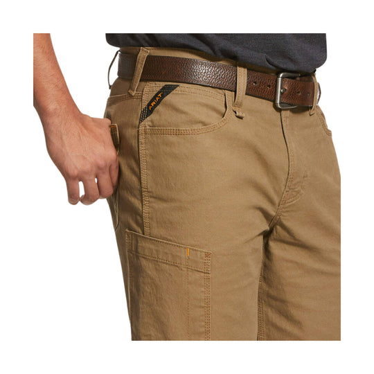 Tan work shorts with reinforced pockets, worn with a brown belt