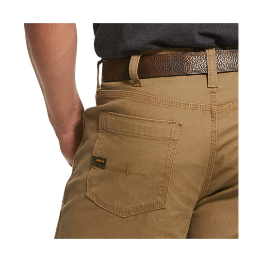 Tan men’s work shorts with a back pocket, belt, and visible ARIAT tag