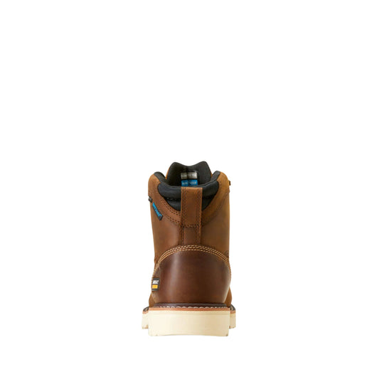 Brown leather work boot viewed from the back with a black padded collar and thick cream outsole.