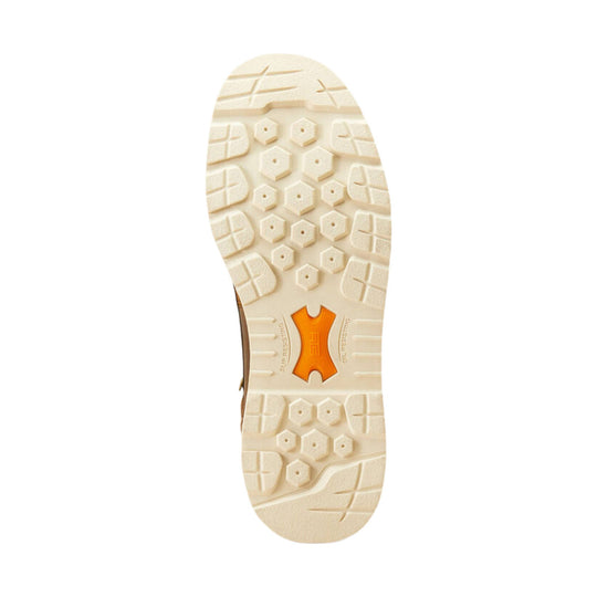 Cream-colored work boot outsole with lug tread and orange shank insert