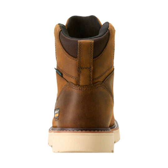 Brown leather work boot shown from the back with a cream wedge sole and pull tab