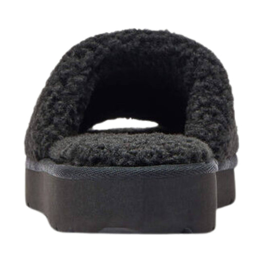 Black fuzzy slide slipper with an open back and thick sole