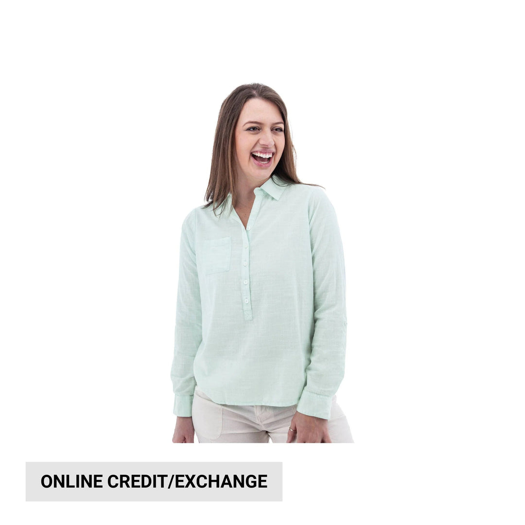 Light mint long-sleeve button-front blouse on a model with cream pants