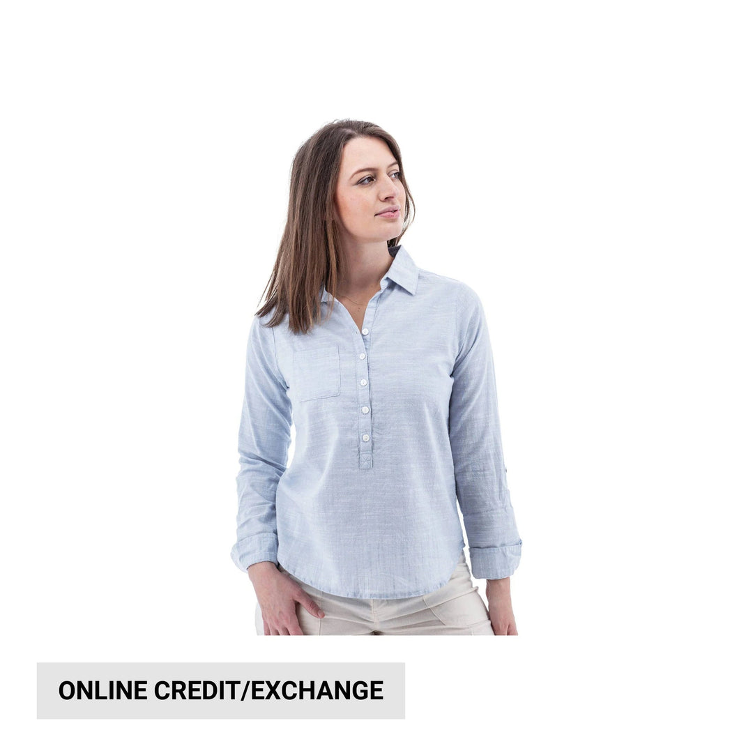 Light blue button-front long-sleeve blouse on a woman against a white background