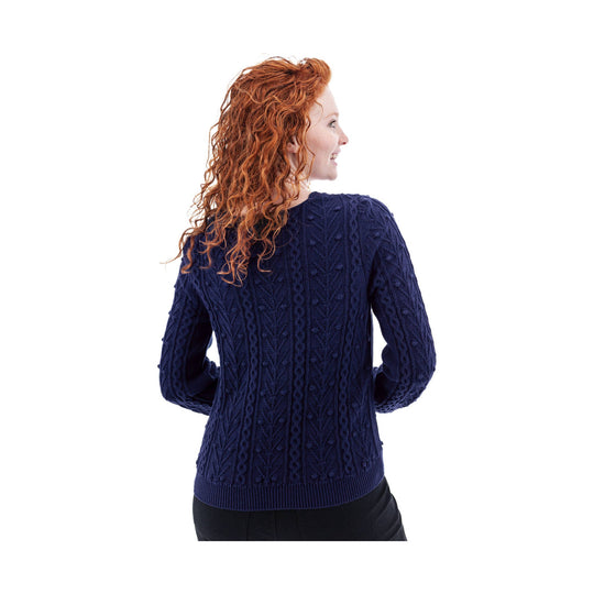 Dark navy cable-knit sweater shown from the back on a model