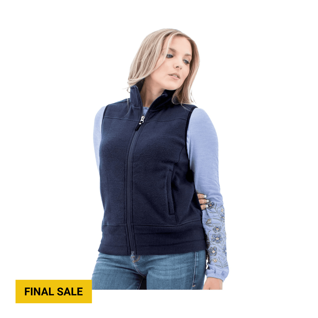 Navy zip-front vest over a light blue floral long-sleeve top