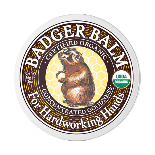 Round tin of hand balm with a bear label and USDA Organic seal