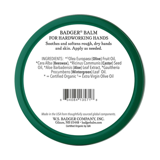 Round green tin lid for hand balm with ingredient list and barcode