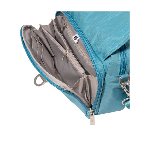 Teal crossbody bag open to show gray interior pockets and zip compartments