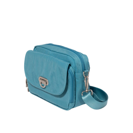 Blue crossbody camera bag with flap closure, zipper trim, and adjustable strap