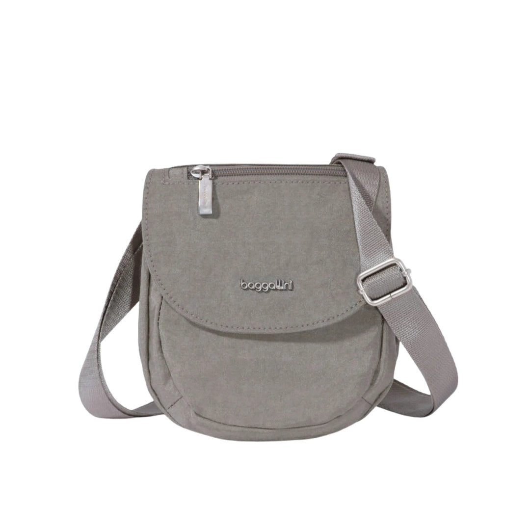 Gray small crossbody bag with front flap, top zipper, and adjustable strap