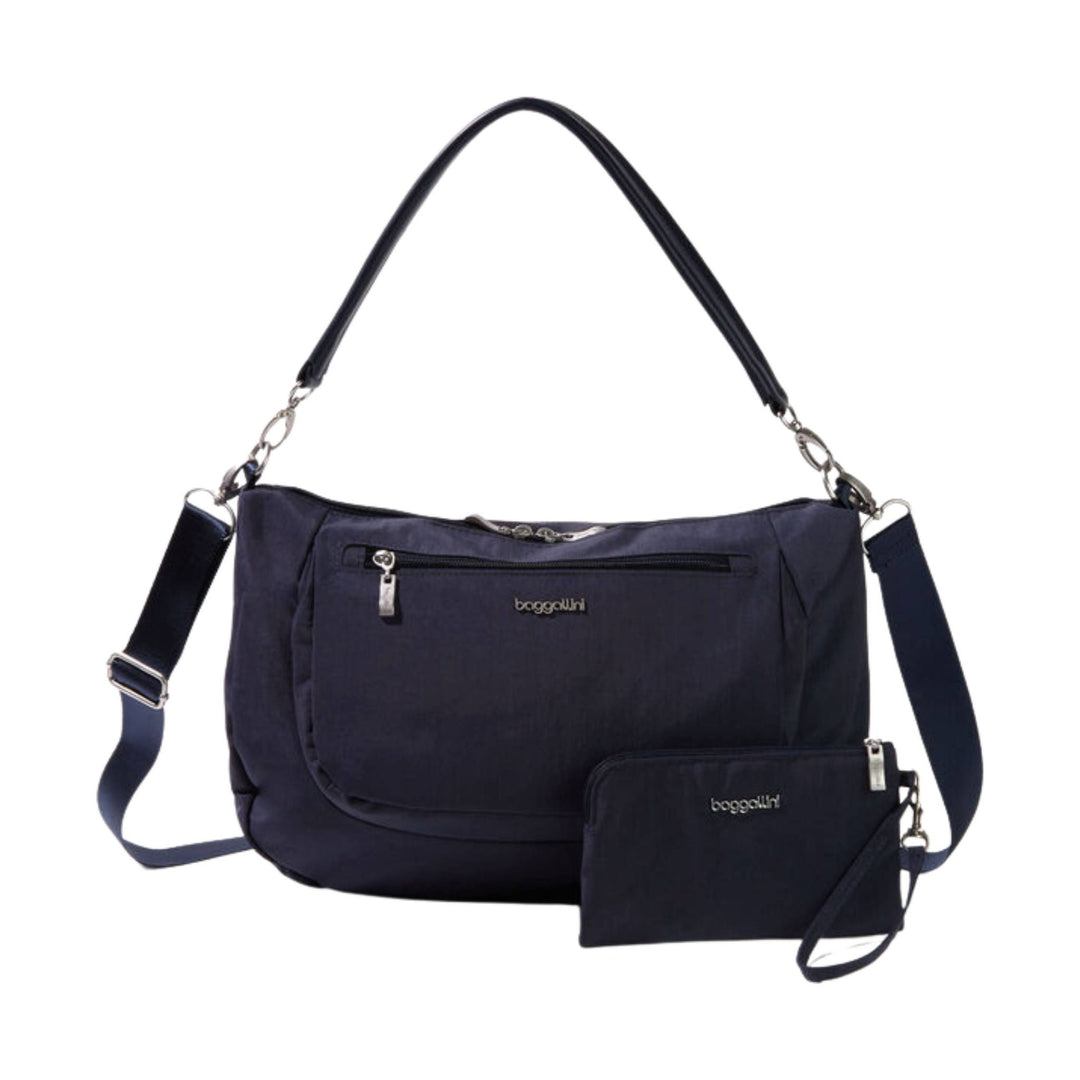 Navy shoulder bag with front zip pocket, detachable strap, and matching zip pouch