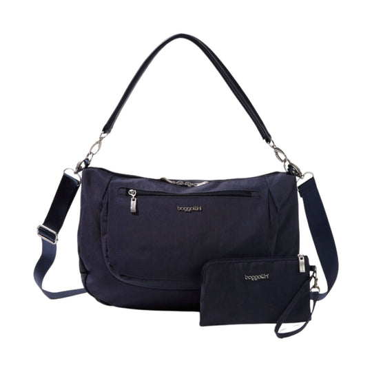 Navy shoulder bag with front zip pocket, detachable strap, and matching zip pouch