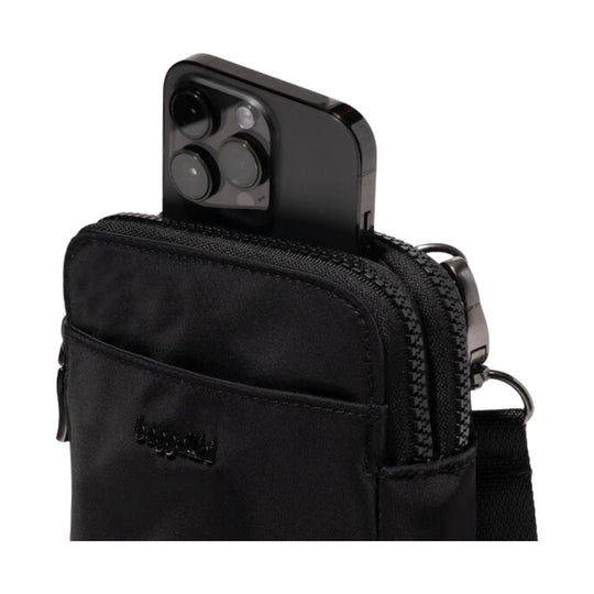 Black zippered crossbody pouch with a smartphone in the front pocket