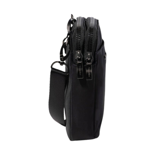 Black crossbody bag shown in side view with dual top zippers and a detachable strap
