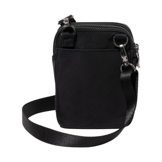 Black compact crossbody bag with front pocket, top zip closure, and adjustable strap