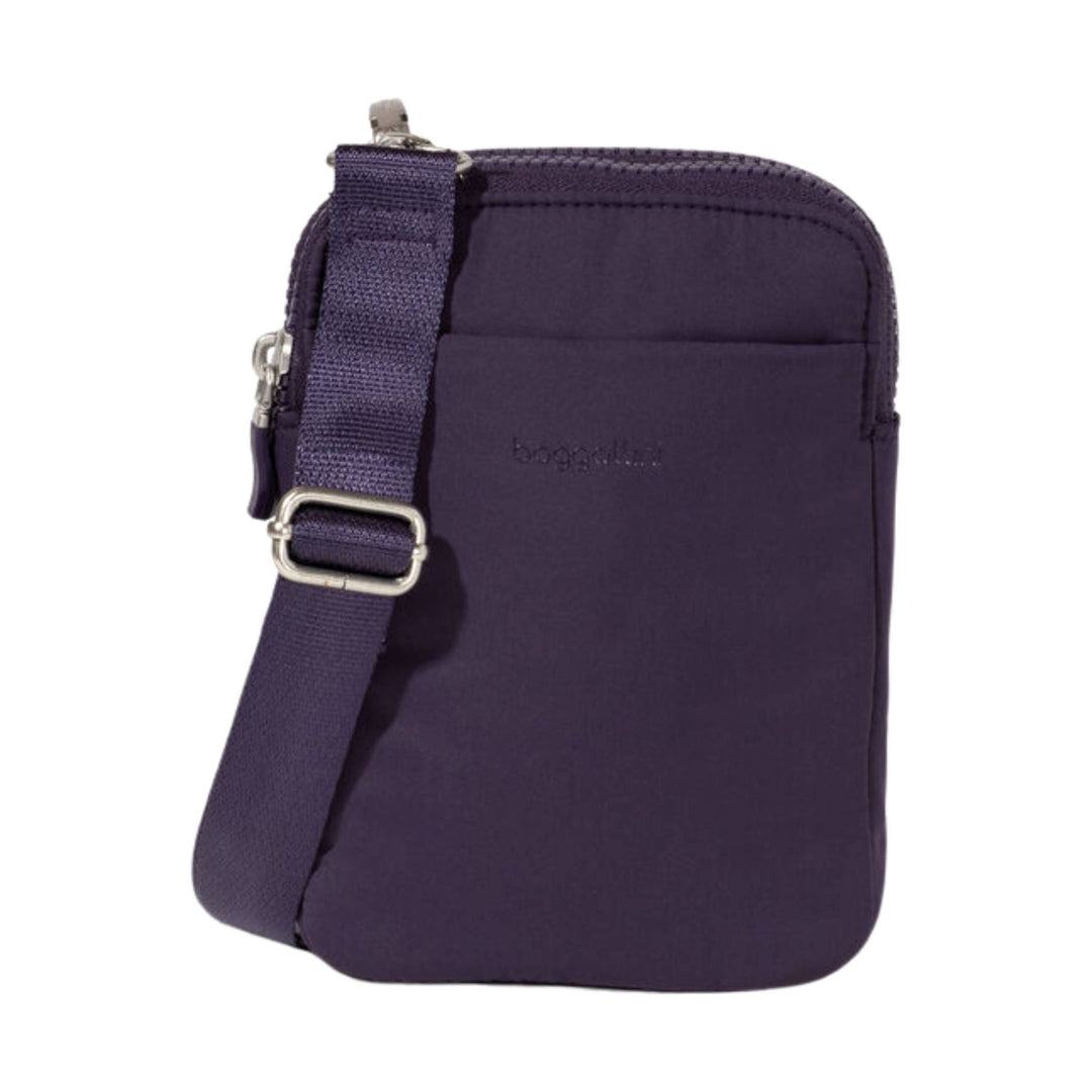 Purple crossbody pouch with adjustable strap and top zipper